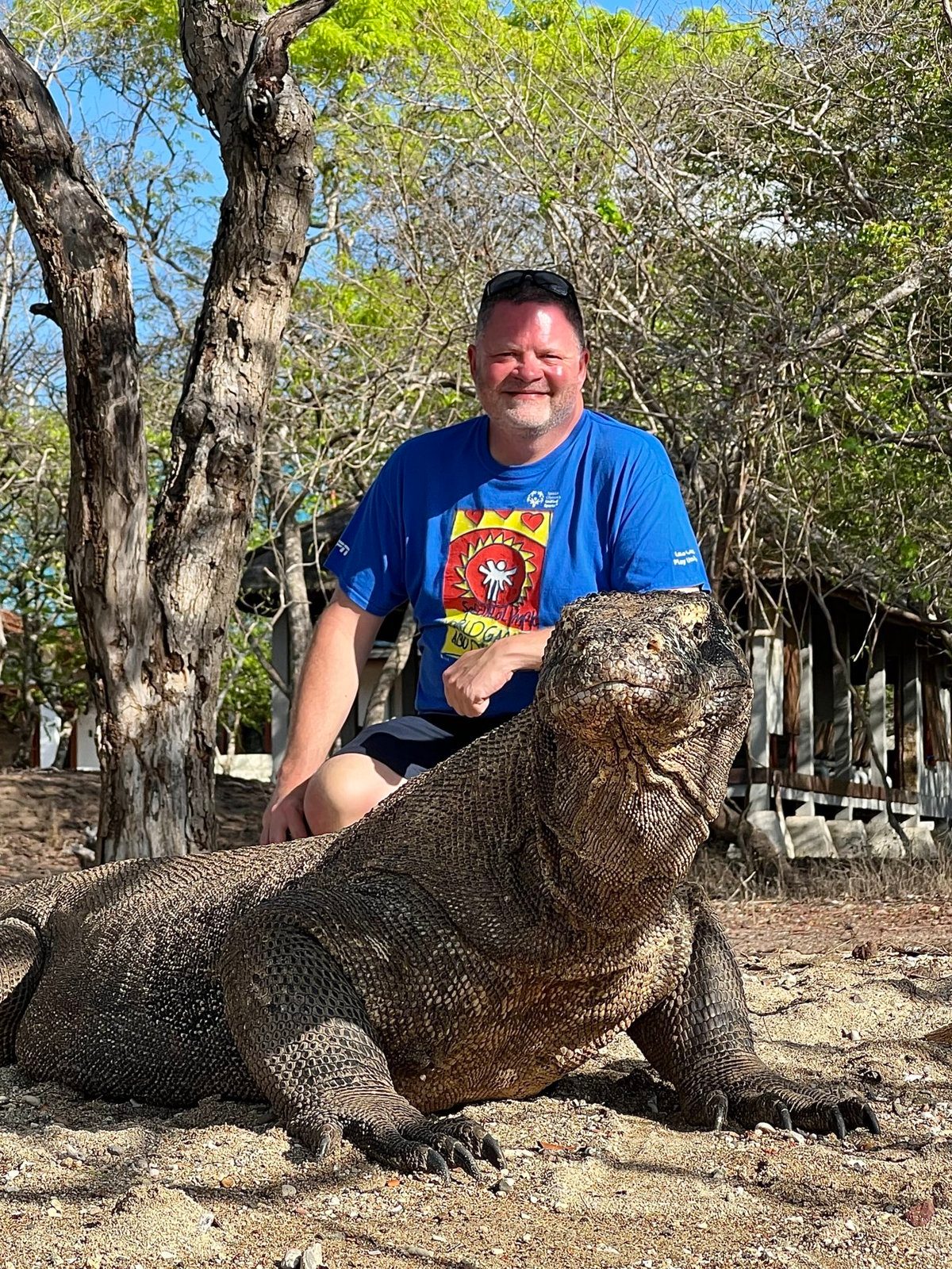 Darrell Seale with a Komodo dragon at Loh Liang, Komodo Island